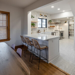 kitchen with new interior design features including lights, stools and decor.
